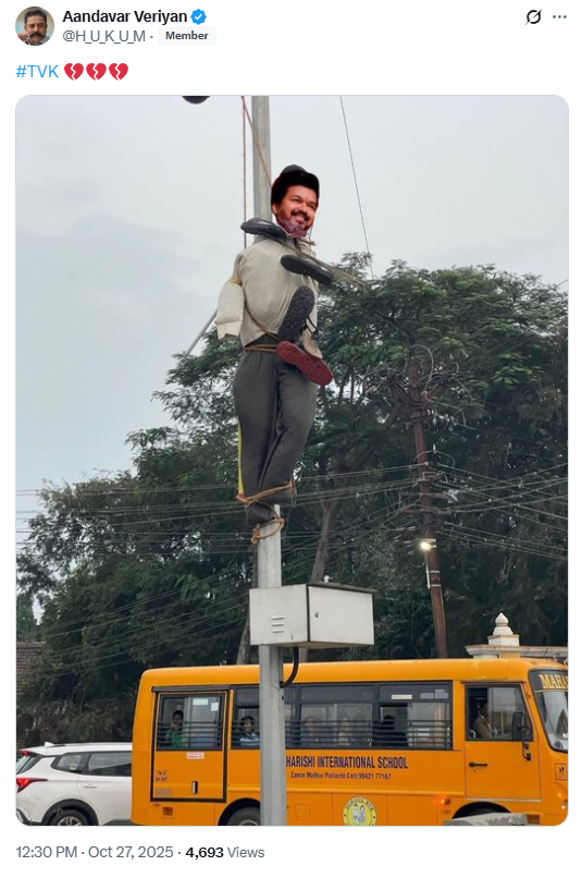 விஜய் உருவ பொம்மையை மின்கம்பத்தில் கட்டி செருப்பு மாலை அணிவித்ததாக பரவும் படம்.